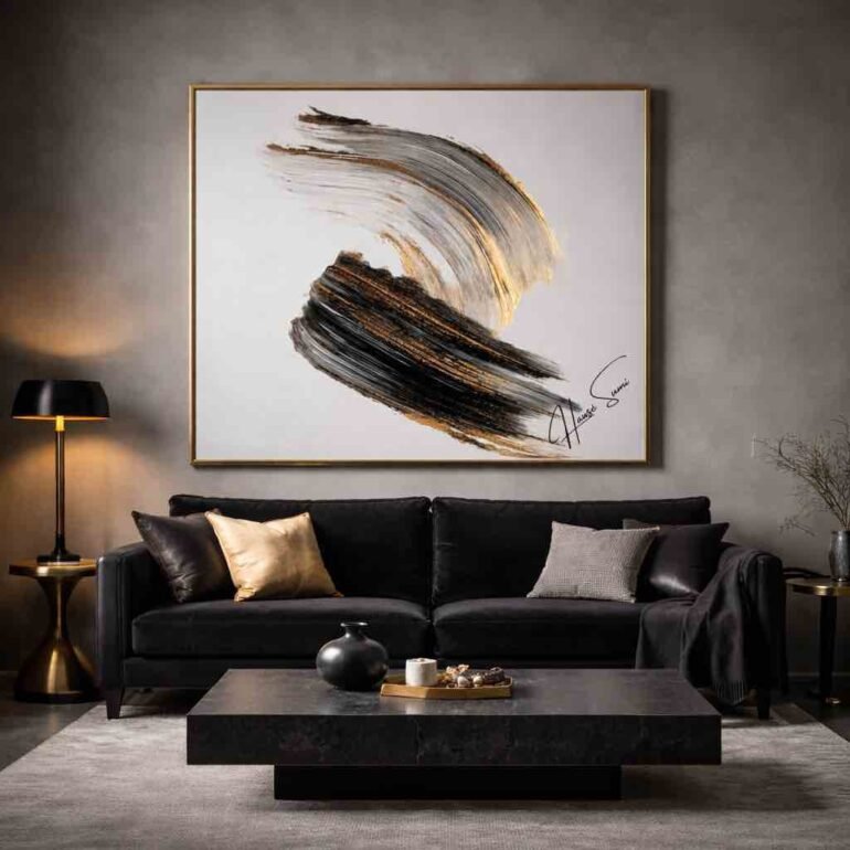 Emotional interior design featuring black, gold, and gray abstract artwork above a black velvet sofa in a moody luxury living room.